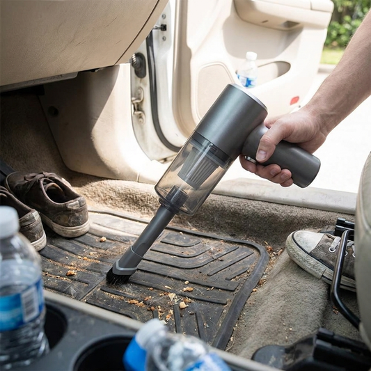 Cordless car vacuum cleaning a car