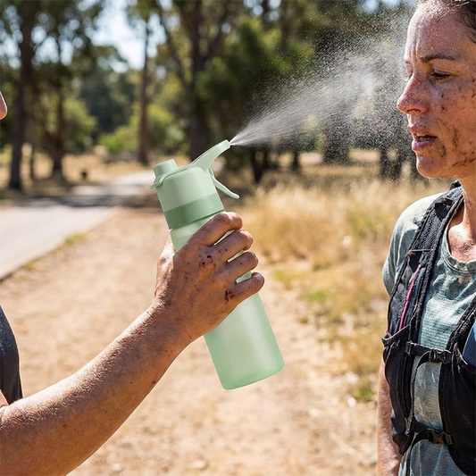Sports spray water bottle in use